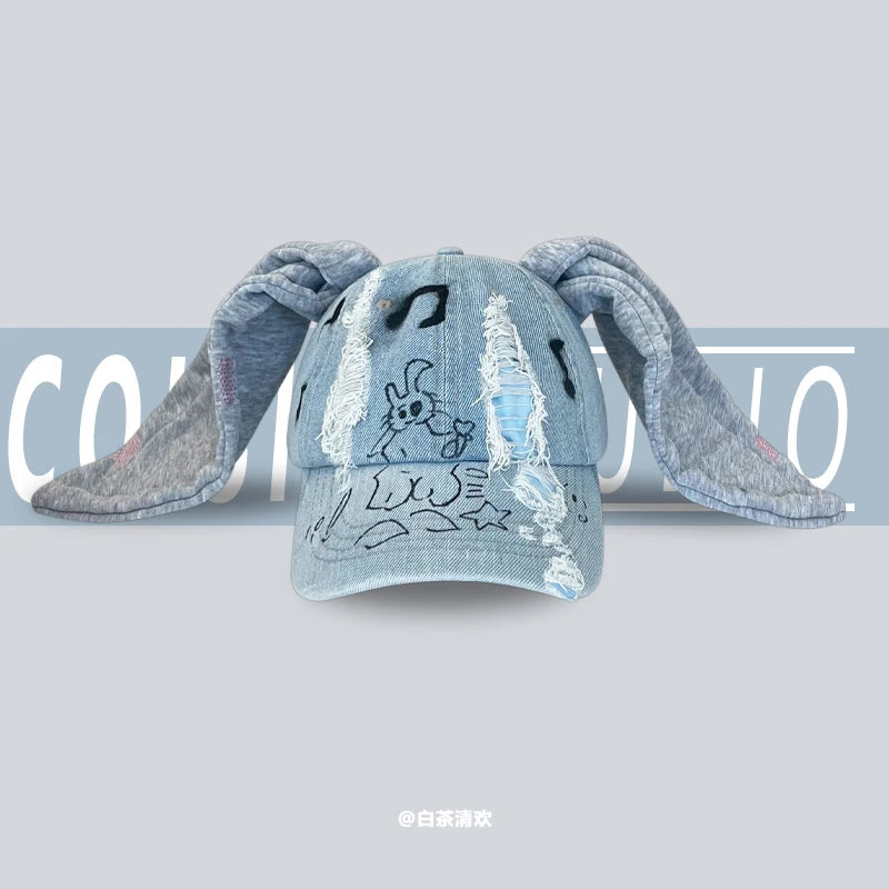 Niche Y2k Baseballkappe mit Hasenohren aus zerrissenem Denim für Damen und Herren, dunkles Design, Metallring, Street-Trend, verstellbare Sportkappe